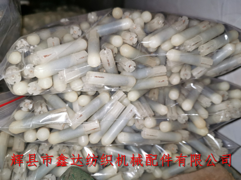 Textile shuttle shaft accessories